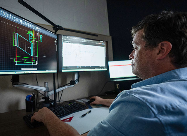 Worker doing CAD design on computer